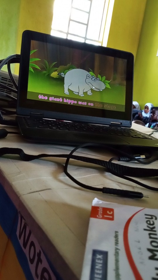 Students watching a movie screening in a school hall
